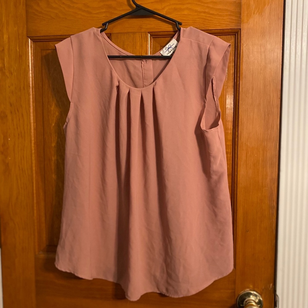 Blush pink top with buttons on the back